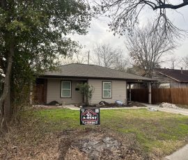 The same home with the yard restored and our sign out front