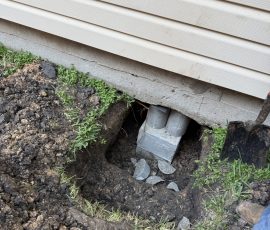 Pier holding the slab edge under the siding after the lift